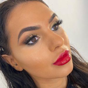 glam makeup with gold eyes and red lip