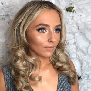 glowy makeup and pin curled hair