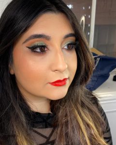 green makeup ook with red lip and winged liner