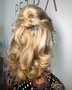 bouncy cursl with a half up do