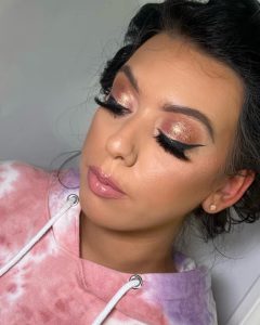 rose gold makeup look with sharp wings